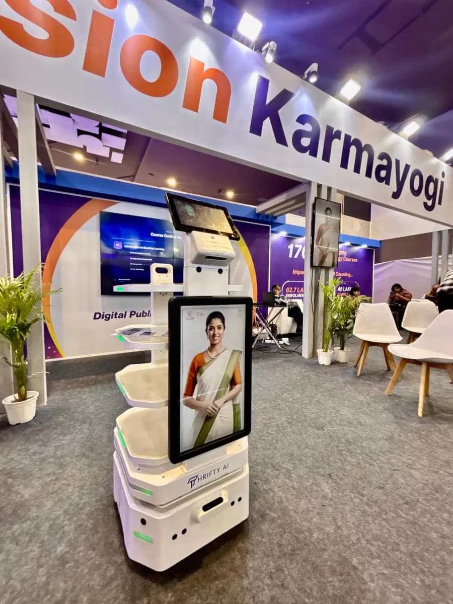 Thrifty AI service robot greeting visitors at the Mission Karmayogi pavilion