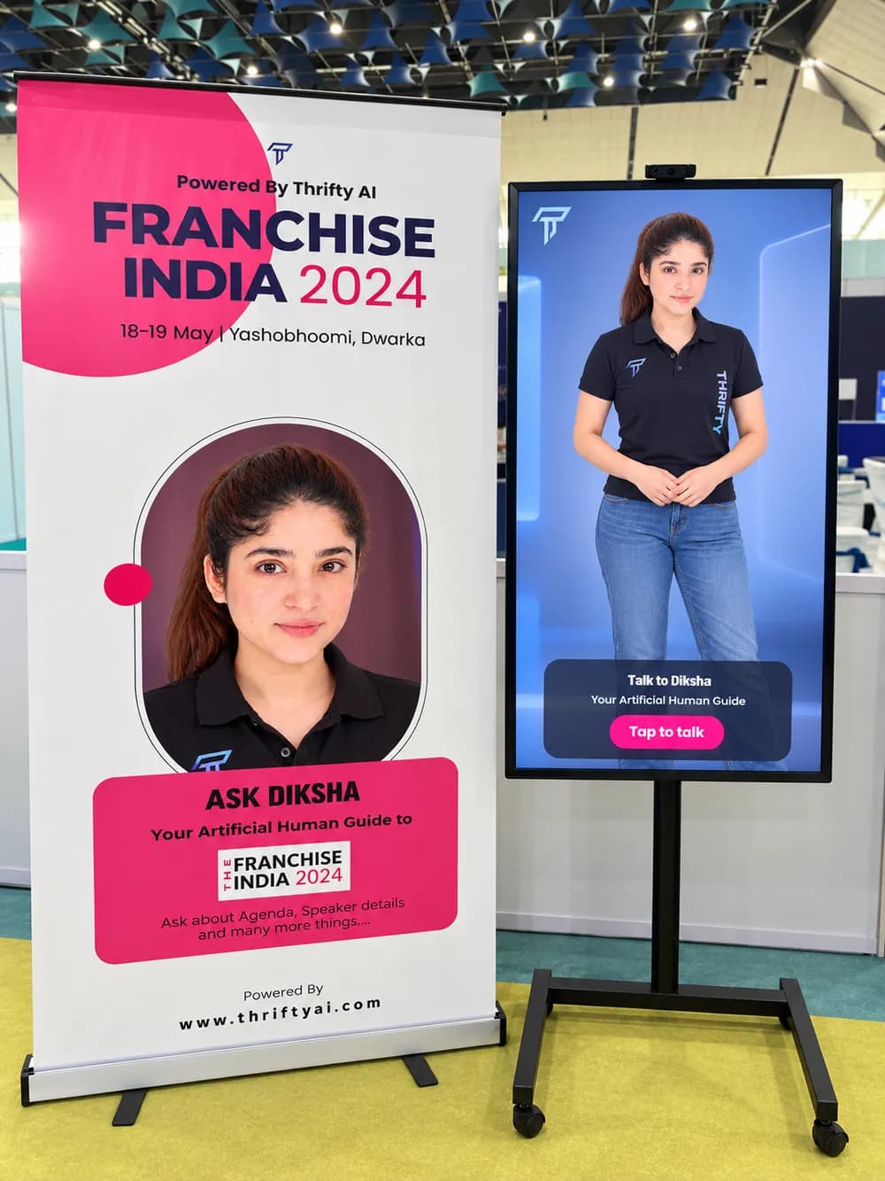 Thrifty AI kiosk with an AI guide on screen beside a Franchise India 2024 banner