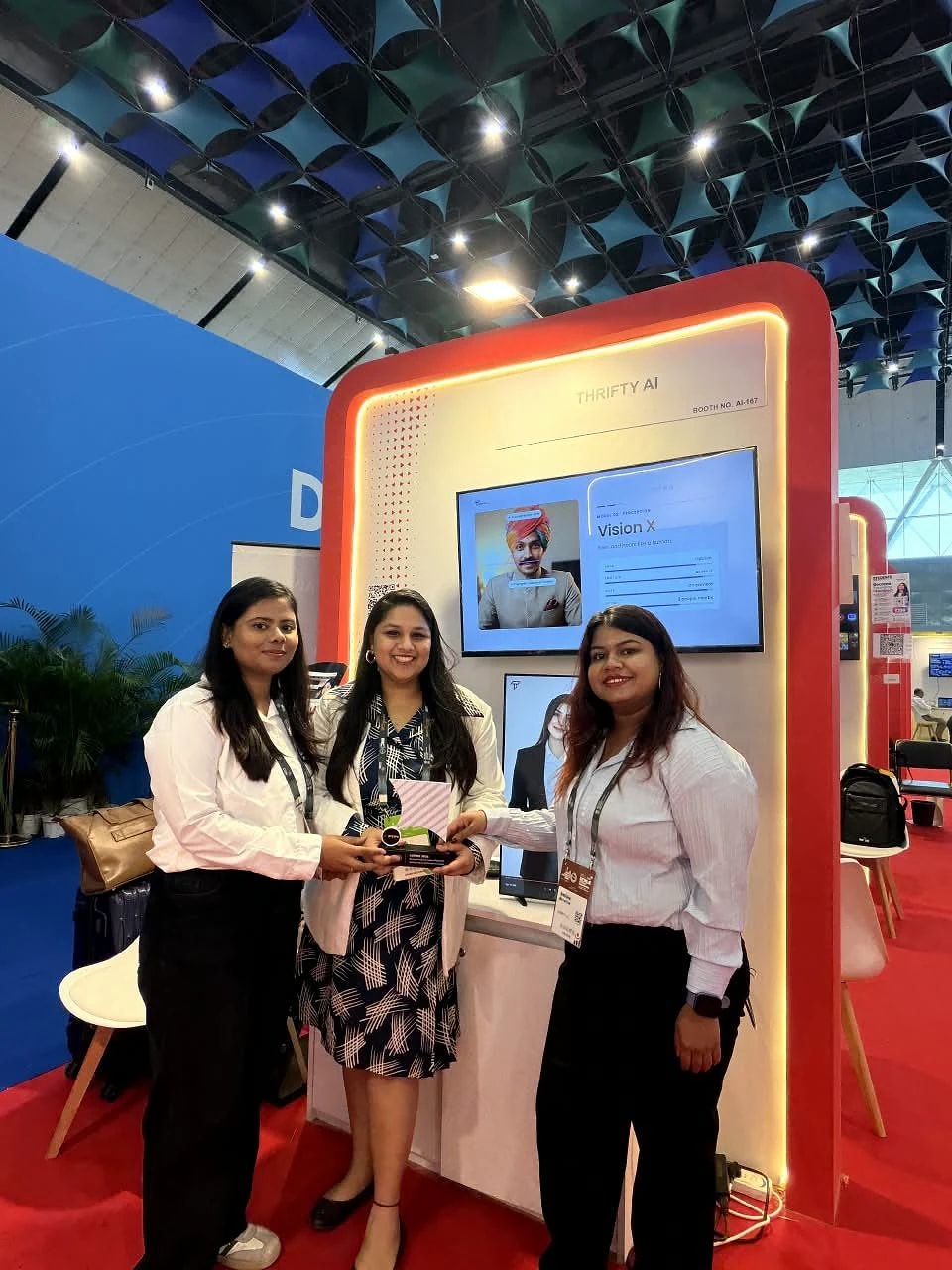 The Thrifty AI team at the stall with Diksha on screen